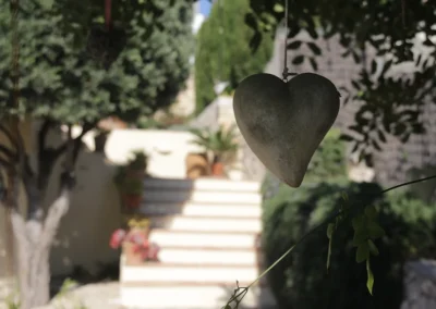 heart ornament hanging in tree