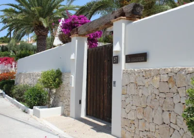 high wall and entrance to villa