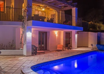 swimming pool lit up at night
